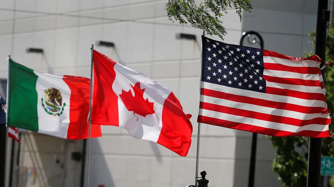 Flags of the U.S., Canada and Mexico fly next to each other in Detroit, Michigan, U.S. August 29, 2018. REUTERS/Rebecca Cook