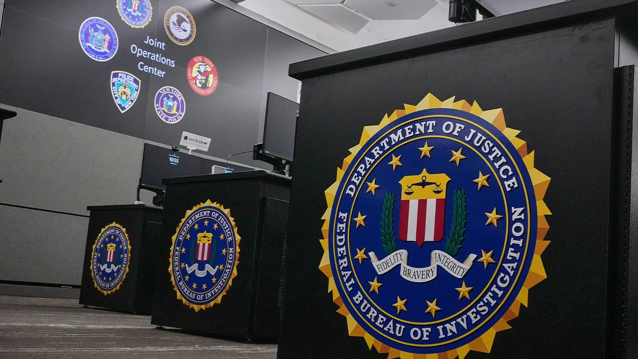 Federal Bureau of Investigation insignias adorn desks in the agency's Joint Operations Center in New York, Thursday, June 4, 2026, ahead of the World Cup soccer tournament. (AP Photo/Richard Drew)