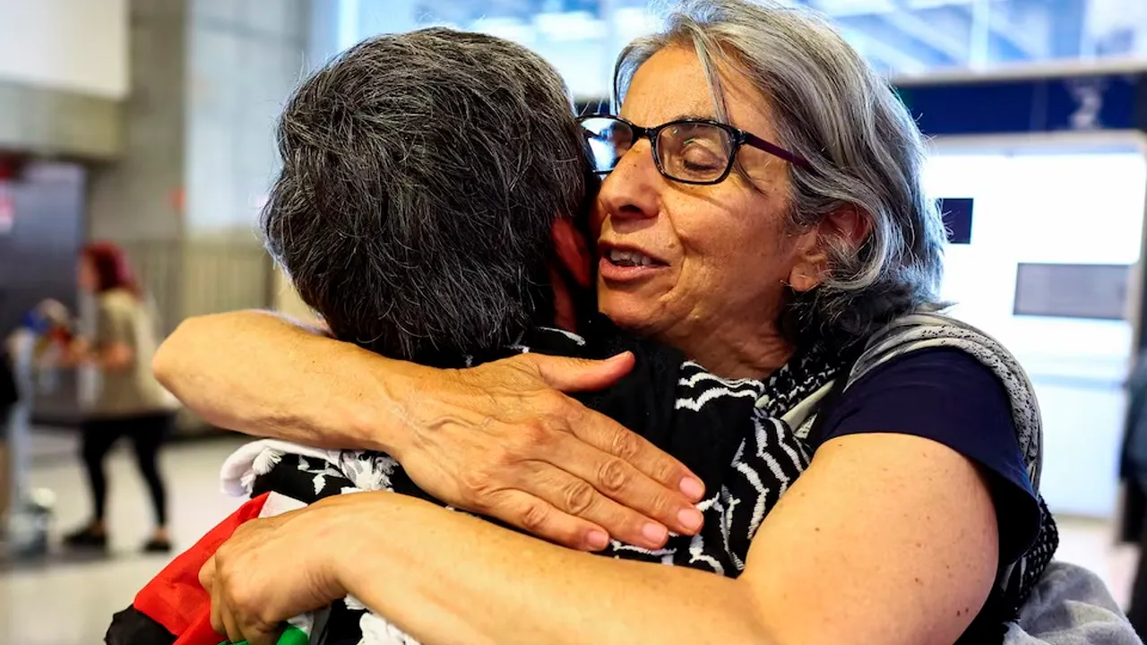 French activists from the Gaza-bound Global Sumud Flotilla, detained by Israeli forces after their vessels were intercepted in international waters in the Mediterranean, arrive at Charles de Gaulle Airport, in Roissy-en-France, near Paris, France May 22, 2026. REUTERS/Abdul Saboor