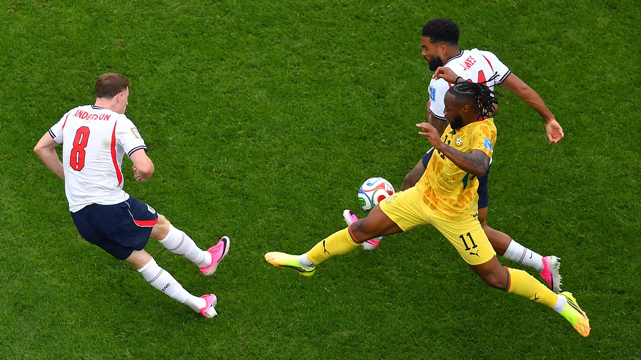 England's Reece James, back right, tries to control the ball as Ghana's Antoine Semenyo (11) and England's Elliot Anderson (8) converge on the ball during the first half of a World Cup Group L soccer match in Foxborough, Mass., near Boston, Tuesday, June 23, 2026. (AP Photo/Steven Senne)