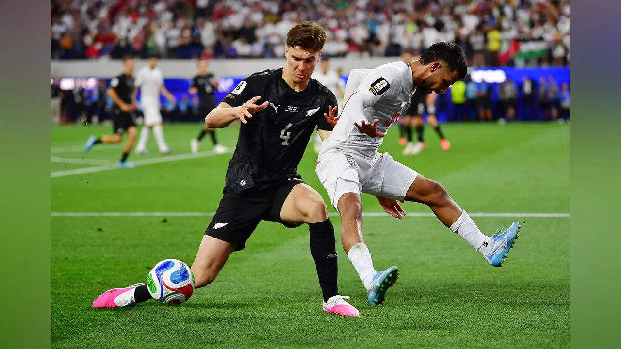 Soccer Football - FIFA World Cup 2026 - Group G - Iran v New Zealand - Los Angeles Stadium, Inglewood, California, U.S. - June 15, 2026 New Zealand's Tyler Bindon in action with Iran's Mehdi Ghayedi IMAGN IMAGES via Reuters/Gary Vasquez