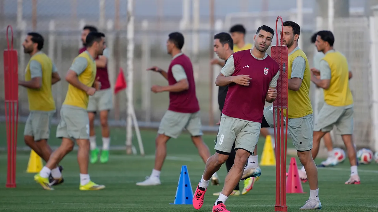 Iran's Mehdi Taremi, right, warms up with teammates during a training session, in Antalya, southern Turkey, Tuesday, June 2, 2026, ahead of the World Cup soccer tournament. (AP Photo/Khalil Hamra)