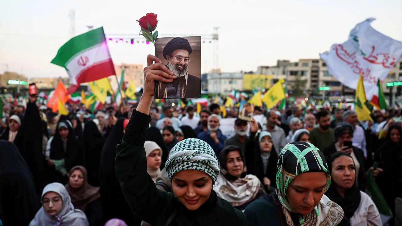 A woman holds an image of Iran's Supreme Leader, Mojtaba Khamenei, during a rally in his support in Tehran, Iran, June 4, 2026. Majid Asgaripour/WANA (West Asia News Agency) via REUTERS