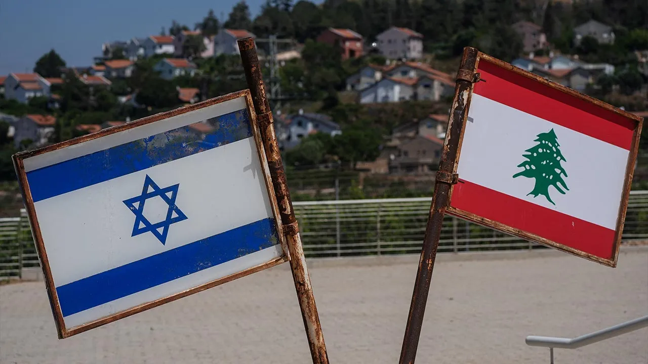 Israel and Lebanon flags at a South Lebanon Army memorial at the Good Fence crossing in Metula, northern Israel, June 8, 2026. REUTERS/Ayal Margolin ISRAEL OUT. NO COMMERCIAL OR EDITORIAL SALES IN ISRAEL