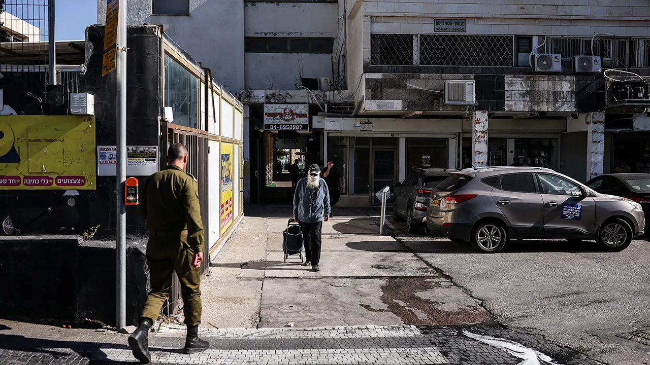 An Israeli soldier crosses a road in Kiryat Shmona, northern Israel, June 2, 2026. REUTERS/Shir Torem