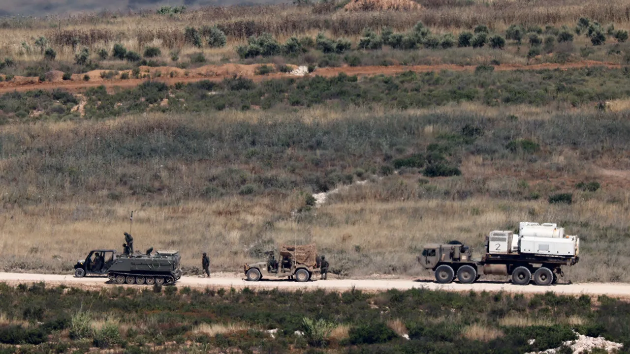 Israeli soldiers near military vehicles in Lebanon, as seen from the Israeli side of the Israeli-Lebanese border, June 1, 2026. REUTERS/Amir Cohen