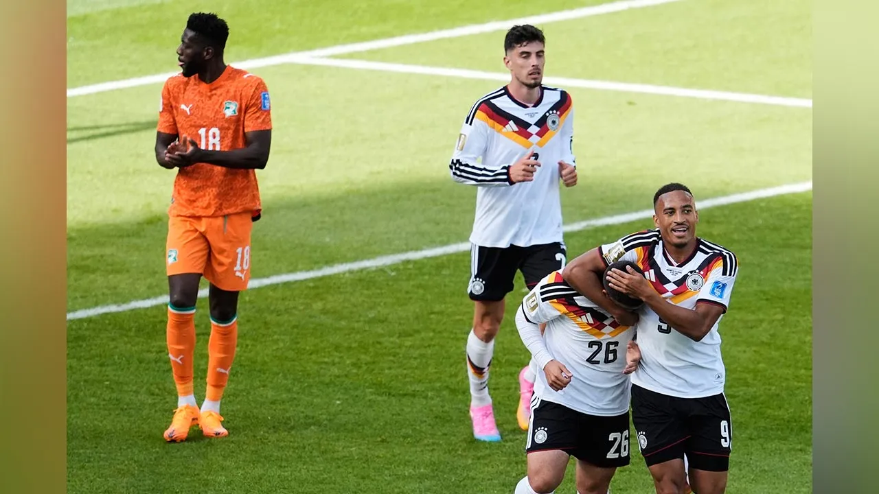 Germany's Deniz Undav (26) celebrates with Jamie Leweling (9) after Undav scored his first goal in the World Cup Group E soccer match between Germany and Ivory Coast in Toronto, Saturday, June 20, 2026. (AP Photo/Olivia White)