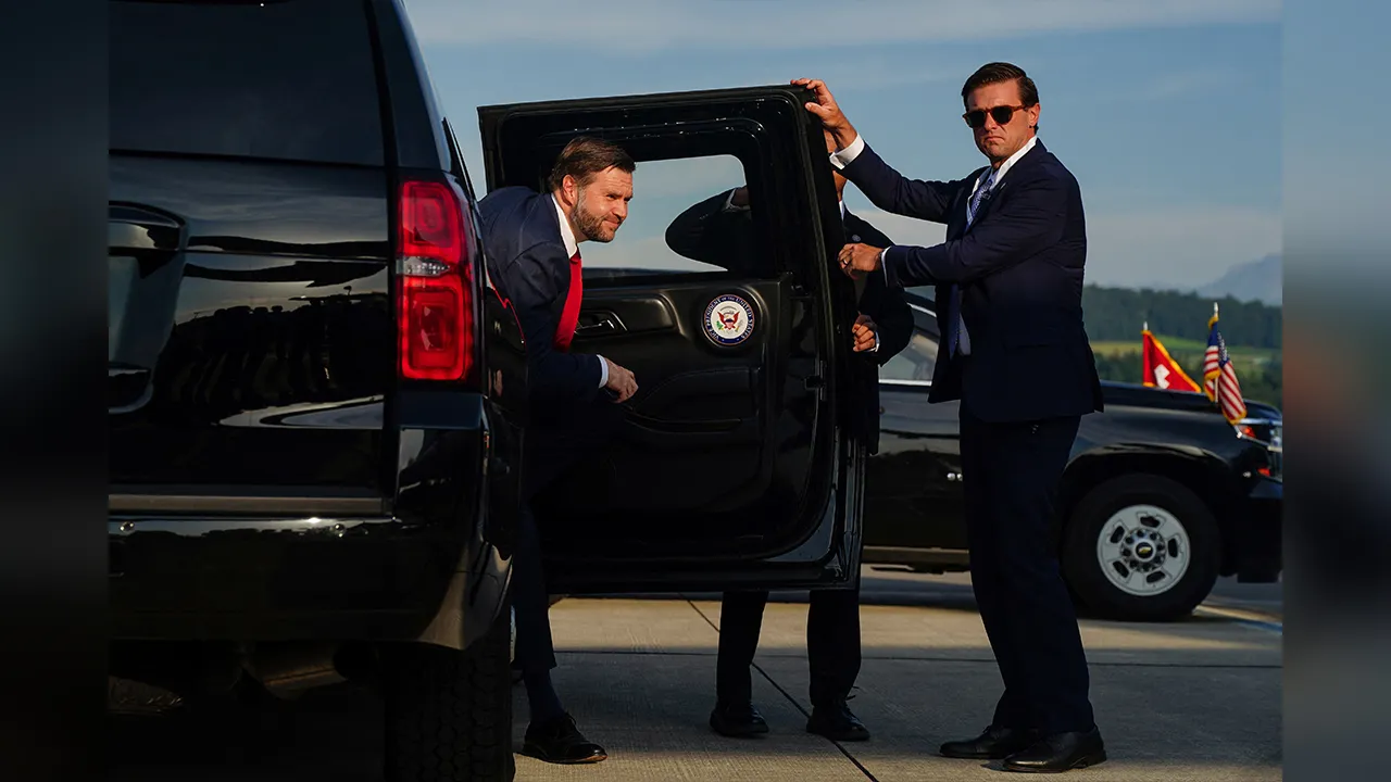 U.S. Vice President JD Vance exits a vehicle as he arrives to board Air Force Two at Emmen Military Air Base, after the U.S. and Iran held high-level talks at the Lake Lucerne Summit, in Emmen, Switzerland, June 22, 2026. REUTERS/Nathan Howard/Pool