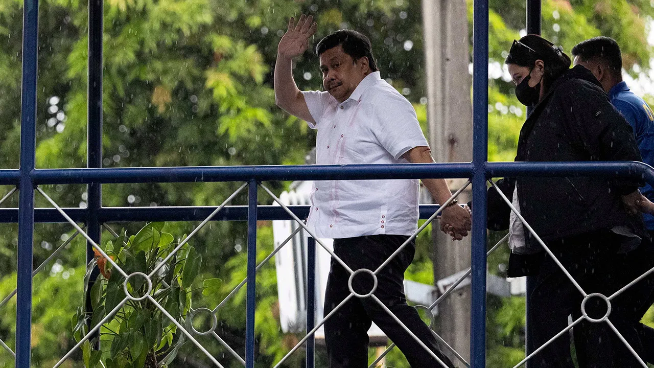 Philippine Senator Jose "Jinggoy" ⁠Estrada waves at the Philippine National Police headquarters after surrendering to the police over a graft case, in Quezon City, Philippines, June 1, 2026. REUTERS/Eloisa Lopez 