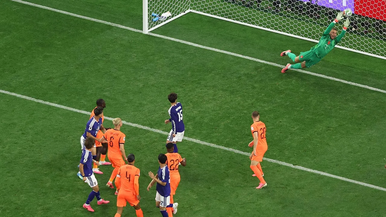 Netherlands goalkeeper Bart Verbruggen (1) gives up a goal to Japan's Daichi Kamada (15) during the World Cup Group F soccer match between the Netherlands and Japan in Arlington, Texas, near Dallas, Sunday, June 14, 2026. (AP Photo/Sam Hodde)