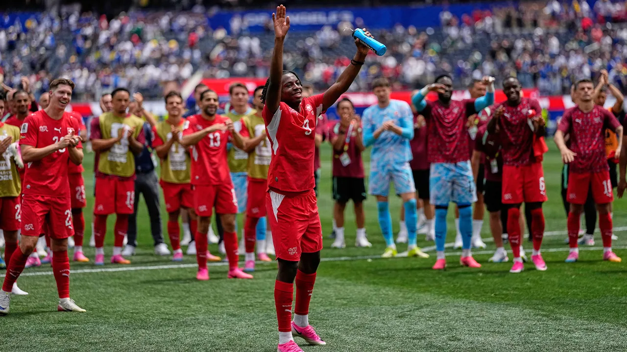 Switzerland's Johan Manzambi (9) front and other teammates wave to fans after the end of the World Cup Group B soccer match between Switzerland and Bosnia in Inglewood, Calif, near Los Angeles, Thursday, June 18, 2026. (AP Photo/Gregory Bull)