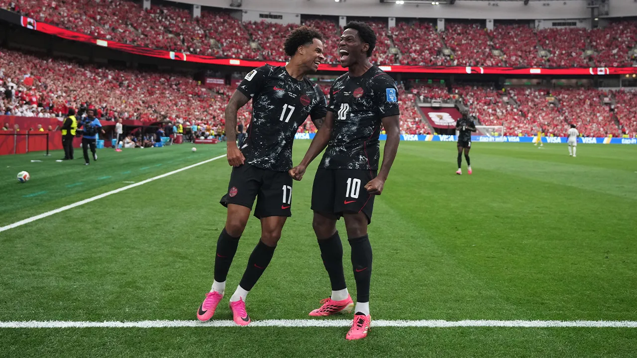 Canada's Jonathan David (10) celebrates with Tajon Buchanan (17) after scoring their second goal during World Cup Group B soccer match between Canada and Qatar in Vancouver, British Columbia, Thursday, June 18, 2026. (Darryl Dyck/The Canadian Press via AP)