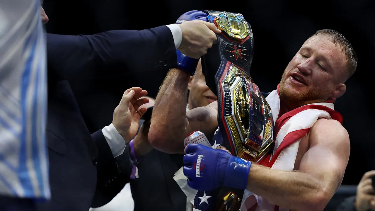 Jun 14, 2026; Washington, D.C., UNITED STATES; Justin Gaethje holds his championship belt after his win against Ilia Topuria (not pictured) during UFC Freedom 250 at White House South Lawn. Mandatory Credit: Amber Searls-Imagn Images