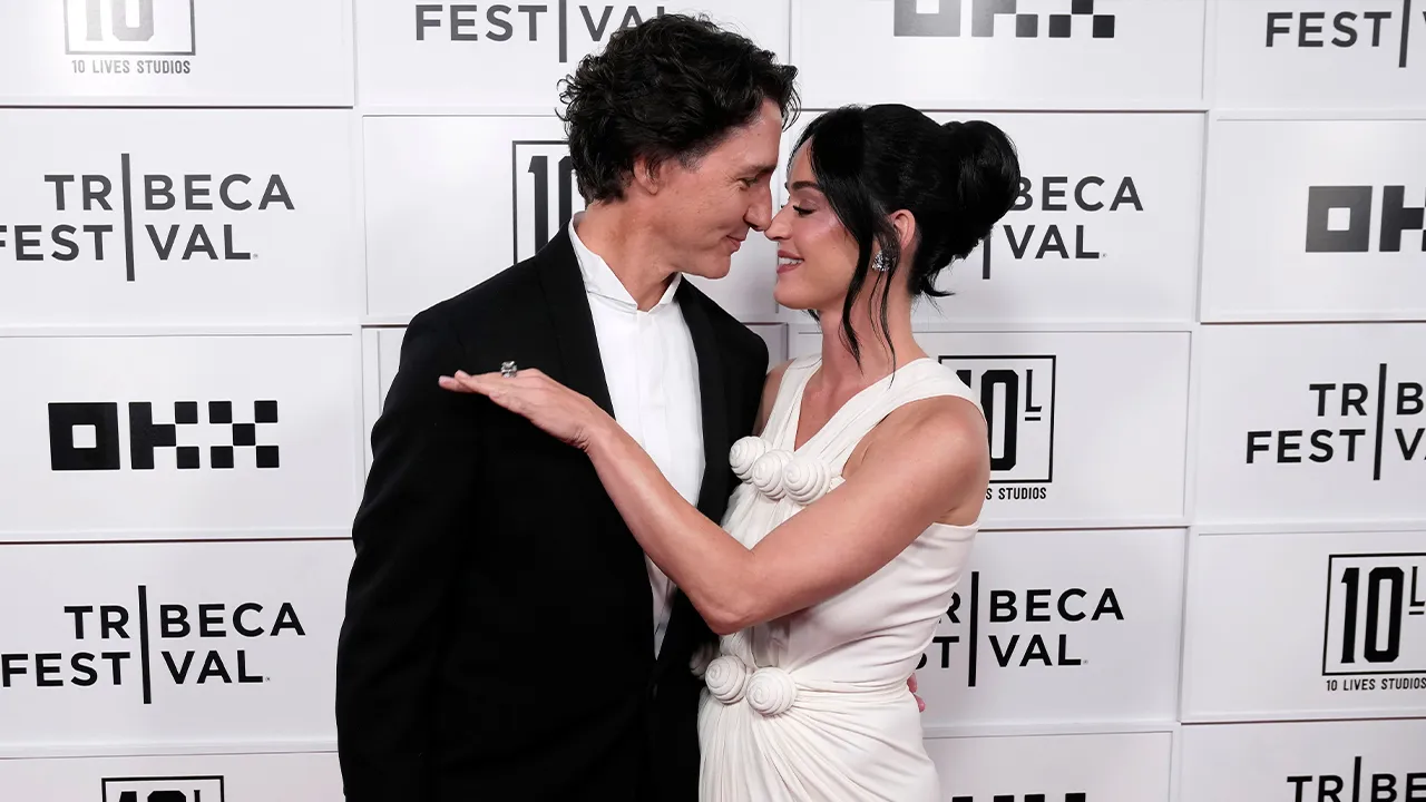 Justin Trudeau, left, and Katy Perry attend the "Katy Perry: The Lifetimes Tour - Live from Paris" world premiere at the OKX Theater at BMCC Tribeca Performing Arts Center during the Tribeca Festival on Monday, May 8, 2026, in New York. (Photo by Charles Sykes/Invision/AP)