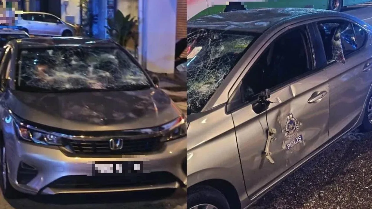 Gambar tular memaparkan sebuah kereta polis rosak akibat dibaling bata oleh suspek pada Rabu. -- SINAR HARIAN