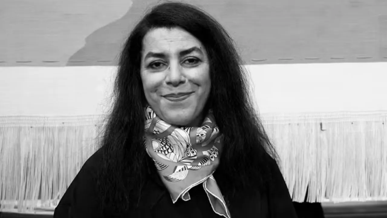 FILE PHOTO: French-Iranian artist Marjane Satrapi poses in front of the Olympic tapestry in Paris, France, March 12, 2024. REUTERS/Benoit Tessier/File Photo