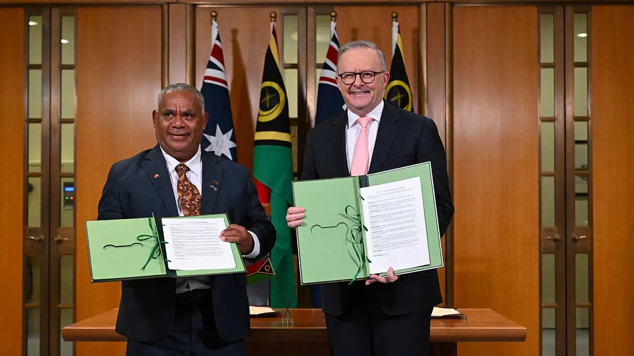 Prime Minister of Vanuatu Jotham Napat and Australian Prime Minister Anthony Albanese pose for photographs after signing the Nakamal agreement during the Australia–Vanuatu Leaders’ Meeting at Parliament House in Canberra, Australia, June 29, 2026. AAP/Lukas Coch via REUTERS ATTENTION EDITORS - THIS IMAGE WAS PROVIDED BY A THIRD PARTY. NO RESALES. NO ARCHIVE. AUSTRALIA OUT. NEW ZEALAND OUT. NO COMMERCIAL OR EDITORIAL SALES IN NEW ZEALAND. NO COMMERCIAL OR EDITORIAL SALES IN AUSTRALIA.