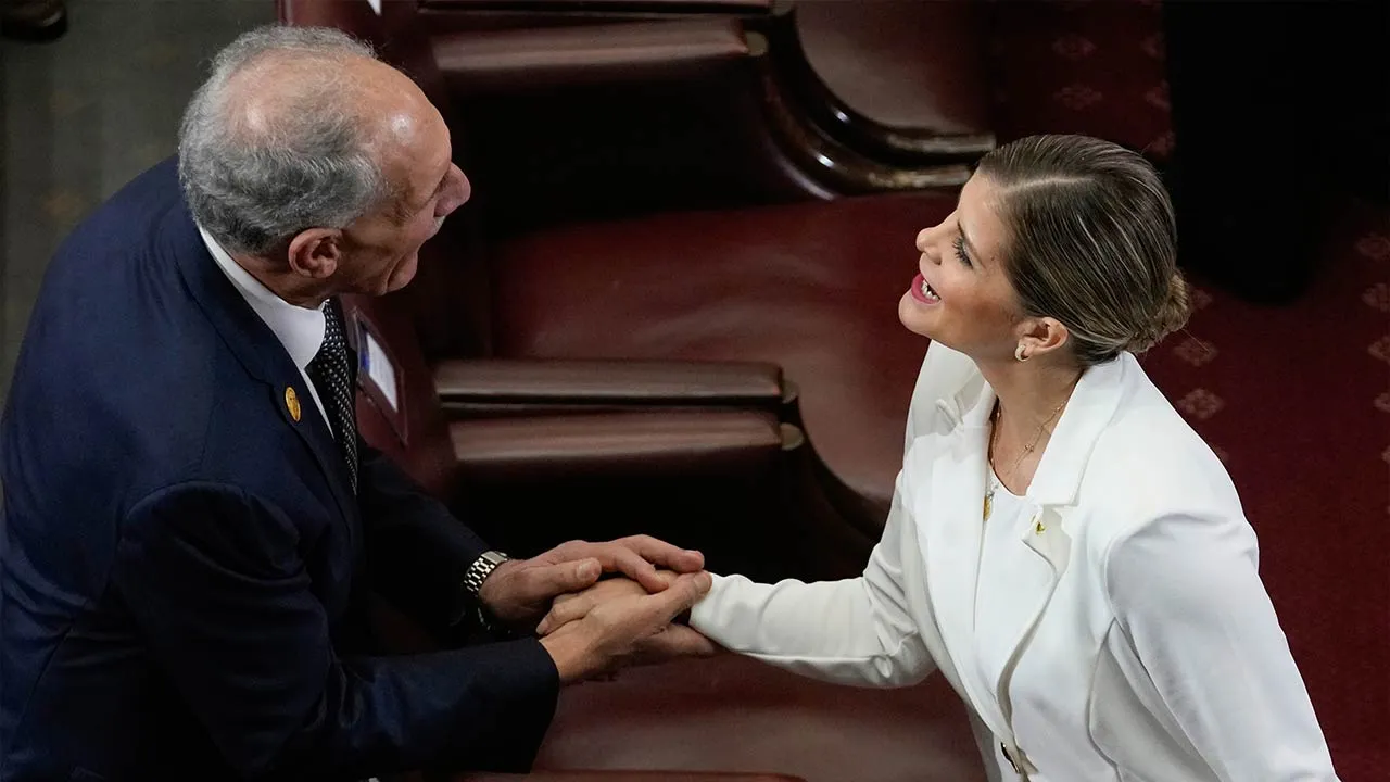 FILE - Honduran President Nasry Asfura, left, and Costa Rica President-elect Laura Fernandez shake hands during the inauguration ceremony of Chile's President Jose Antonio Kast, in Valparaiso, Chile, March 11, 2026. (AP Photo/Esteban Felix, File)