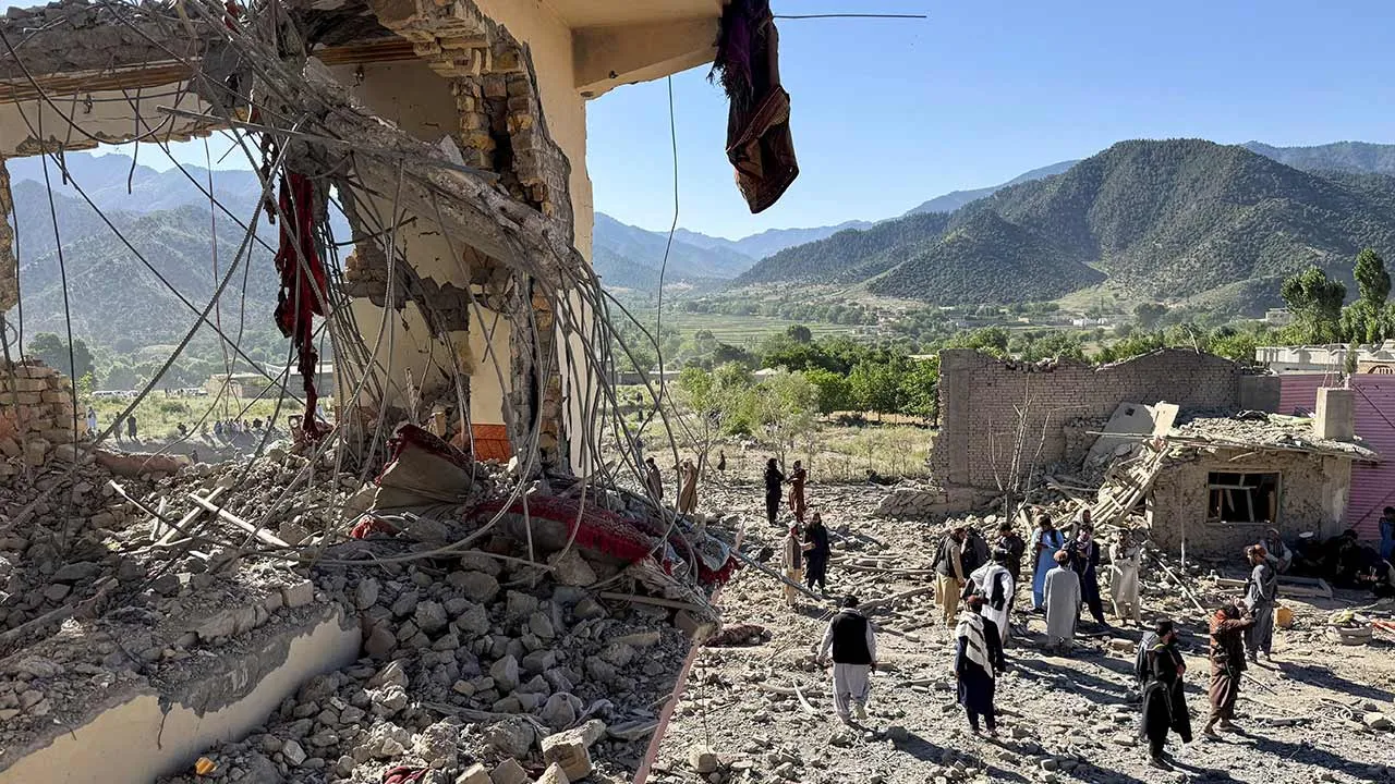 People gather near a destroyed building after an attack, which the Taliban say was an airstrike carried out by Pakistan's security forces, in Samkani District, Paktia Province, Afghanistan, June 29, 2026. REUTERS/Stringer