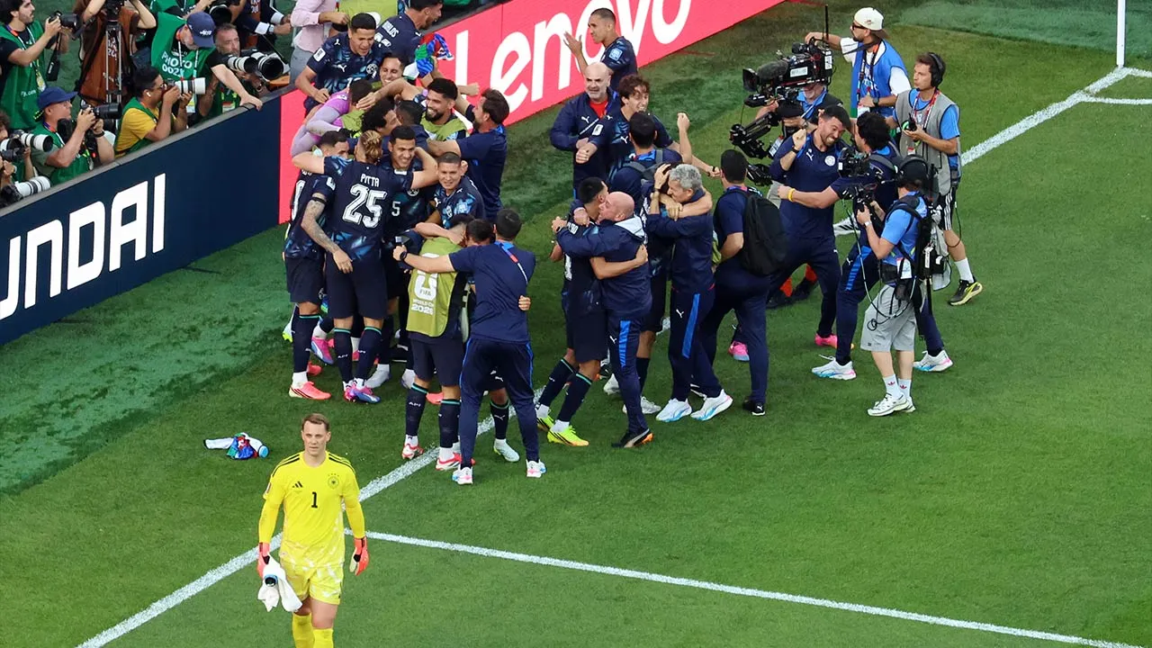 Germany goalkeeper Manuel Neuer (1) reacts as Paraguay players celebrate after a penalty shootout at the end of the World Cup round of 32 soccer match between Germany and Paraguay in Foxborough, Mass., near Boston, Monday, June 29, 2026. (AP Photo/Mark Stockwell)
