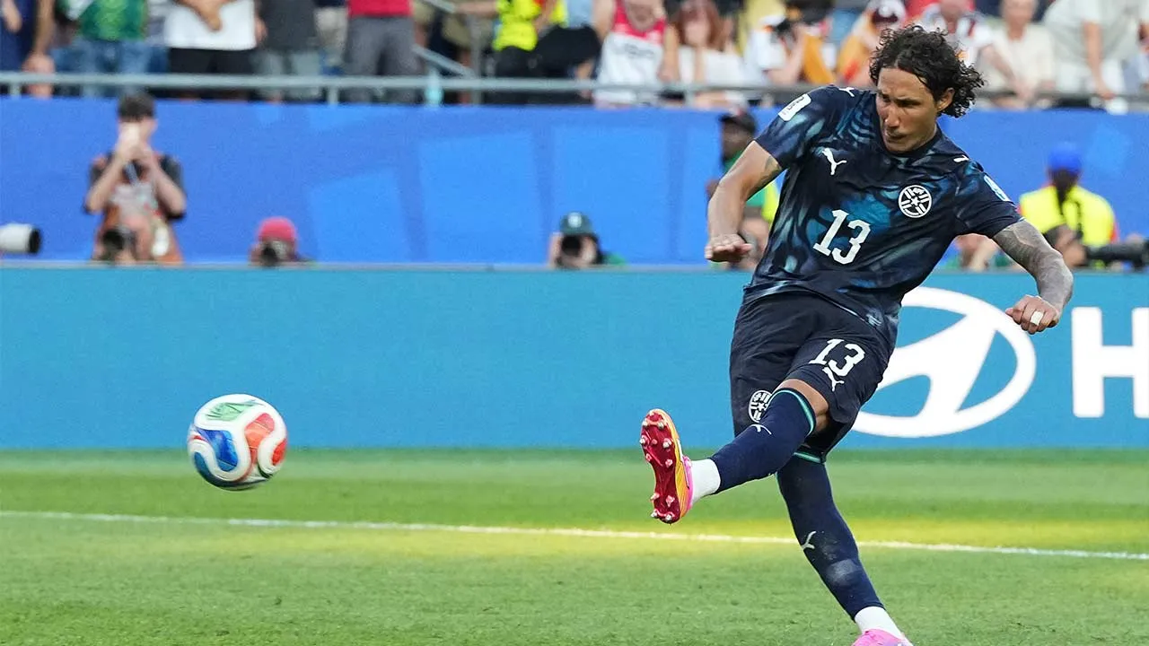 Paraguay's Jose Canale (13) scores a sudden death penalty goal to win the match during the World Cup round of 32 soccer match between Germany and Paraguay in Foxborough, Mass., near Boston, Monday, June 29, 2026. (AP Photo/Martin Meissner)