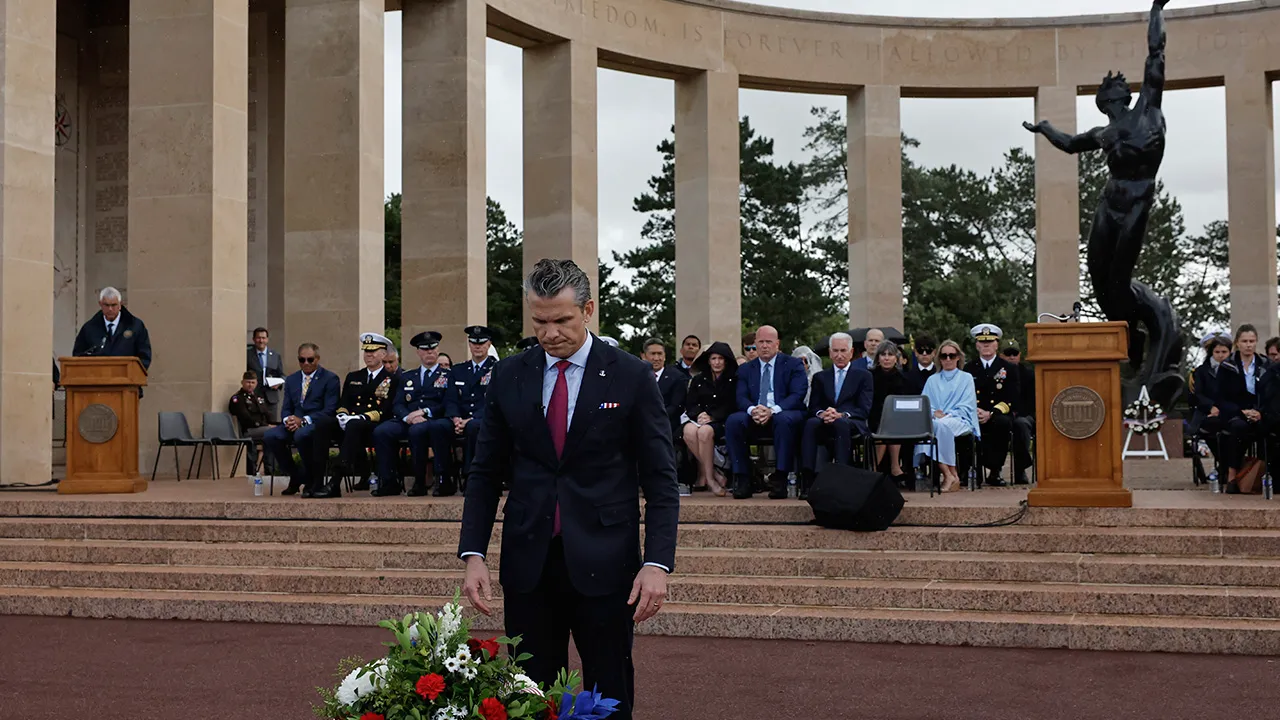 U.S. Defense Secretary Pete Hegseth lays a wreath of flowers during a ceremony at the US cemetery to commemorate the 82nd anniversary of the D-Day landings, in Colleville-sur-Mer, Normandy, France, Saturday, June 6, 2026. (AP Photo/Jeremias Gonzalez)