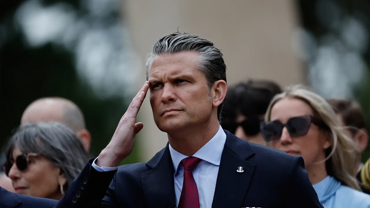 U.S. Defense Secretary Pete Hegseth salutes during a ceremony at the US cemetery to commemorate the 82nd anniversary of the D-Day, in Colleville-sur-Mer, Normandy, France, Saturday, June 6, 2026. (AP Photo/Jeremias Gonzalez)
