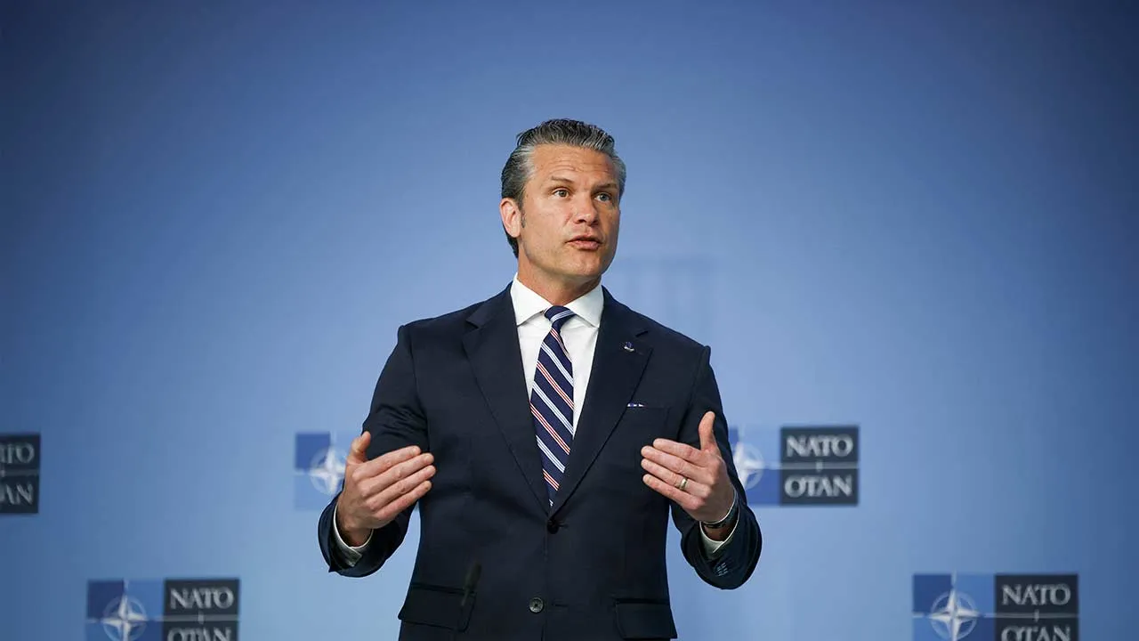U.S. Defense Secretary Pete Hegseth talks to the media on the day of a meeting of NATO defence ministers at the alliance's headquarters in Brussels, Belgium, June 18, 2026. REUTERS/Stoyan Nenov