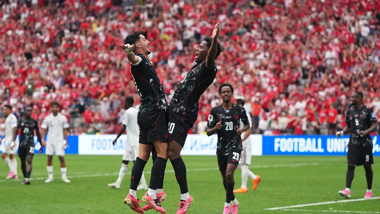 Canada's Jonathan David, front right, celebrates with Stephen Eustaquio,left, after scoring a goal during World Cup Group B soccer match between Canada and Qatar in Vancouver, British Columbia, Thursday, June 18, 2026. (Darryl Dyck/The Canadian Press via AP)