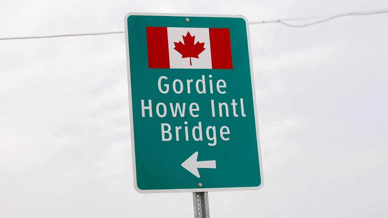 A sign directs traffic to the Gordie Howe International Bridge linking Detroit to Windsor, Ontario, Canada, in Detroit, Michigan, U.S. February 10, 2026. REUTERS/Rebecca Cook/File Photo
