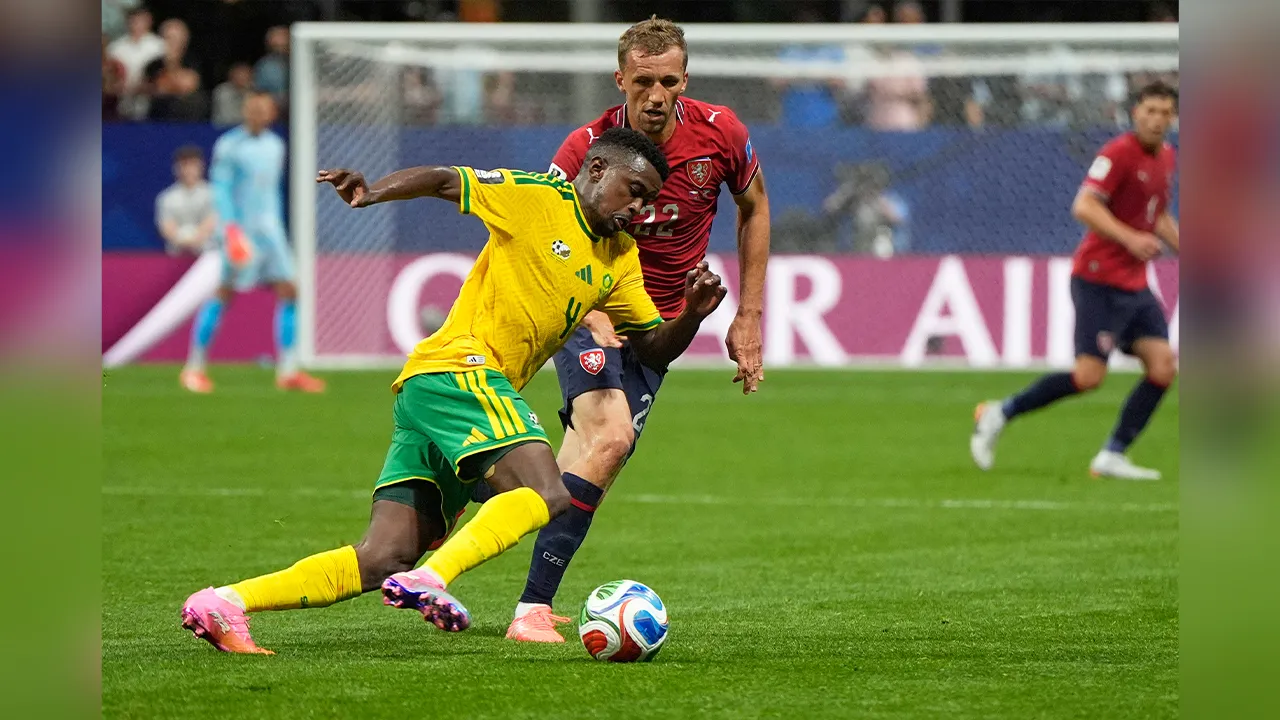 South Africa's Teboho Mokoena drives the ball past Czechia's Tomas Soucek during the World Cup Group A soccer match between Czechia and South Africa in Atlanta, Thursday, June 18, 2026. (AP Photo/Mike Stewart)