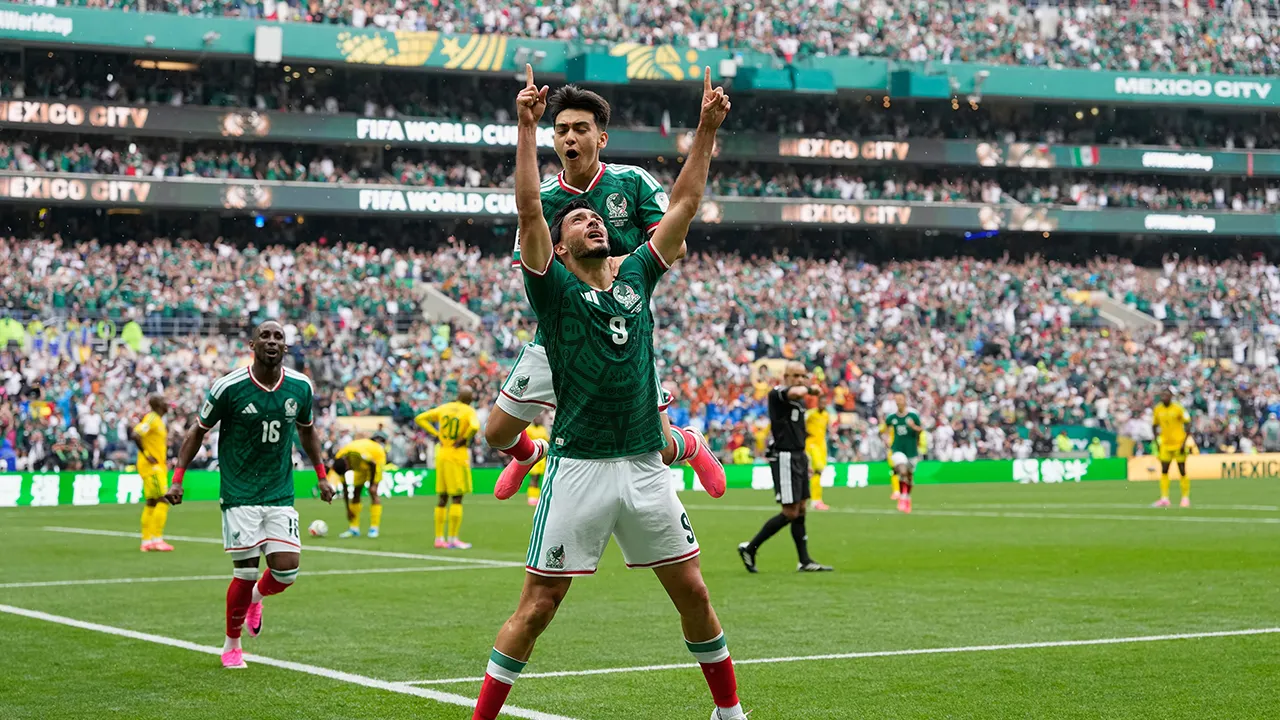 Mexico's Raul Jimenez celebrates after scoring his side's second goal during the World Cup Group A soccer match between Mexico and South Africa in Mexico City, Thursday, June 11, 2026. (AP Photo/Natacha Pisarenko)