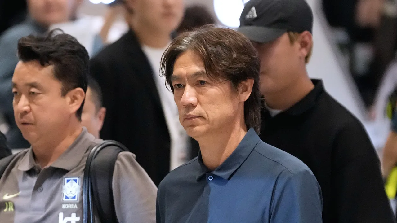 South Korea's soccer head coach Hong Myung-bo, center, who has resigned following the team's early elimination from the World Cup, arrives at the Incheon International Airport in Incheon, South Korea, Tuesday, June 30, 2026. (AP Photo/Ahn Young-joon)