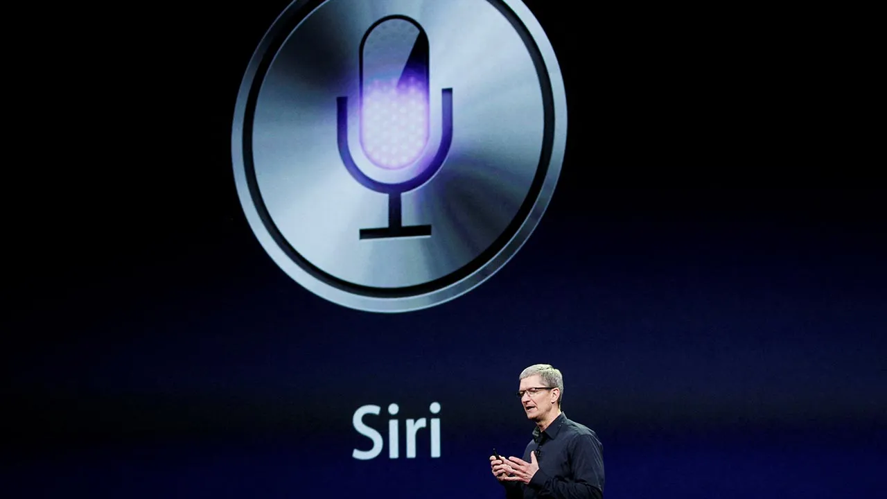 FILE PHOTO: CEO Tim Cook talks about Siri during an Apple event in San Francisco, California March 7, 2012. REUTERS/Robert Galbraith/File Photo