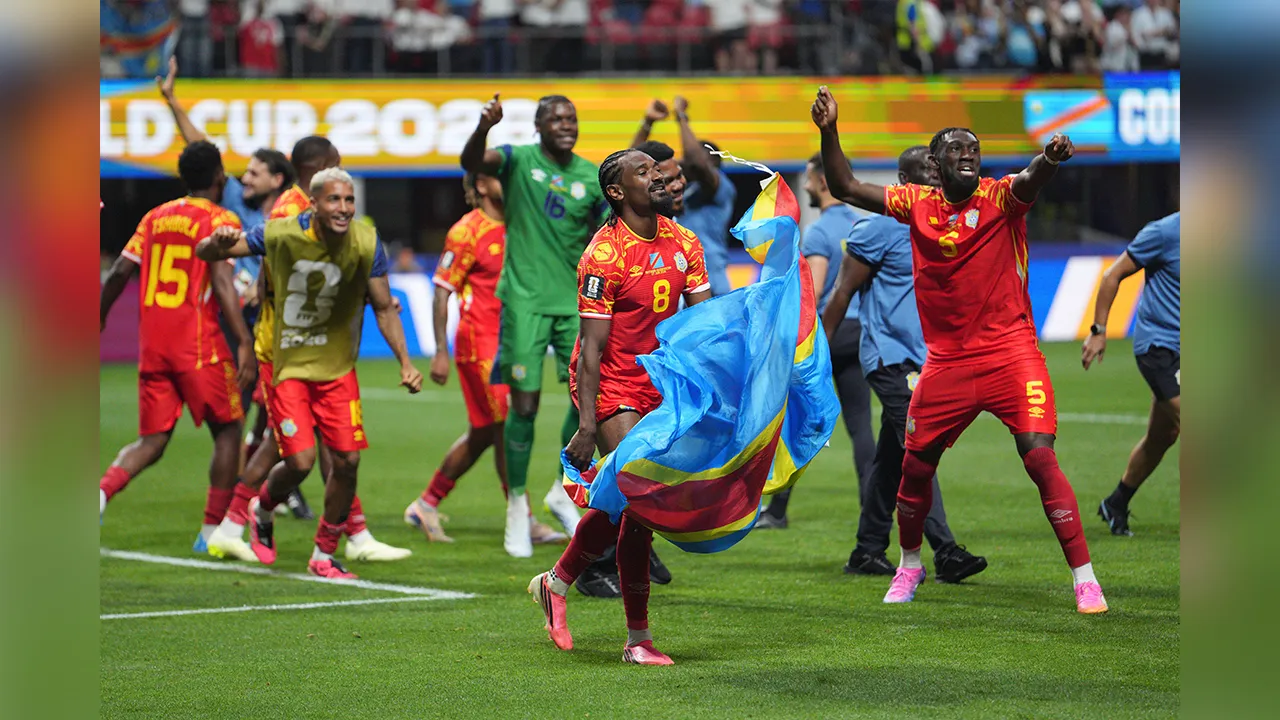 Congo's Samuel Moutoussamy (8) and Congo's Dylan Batubinsika (5) join other teammates in celebrating a win after the World Cup Group K soccer match between DR Congo and Uzbekistan in Atlanta, Saturday, June 27, 2026. (AP Photo/Jacob Kupferman)