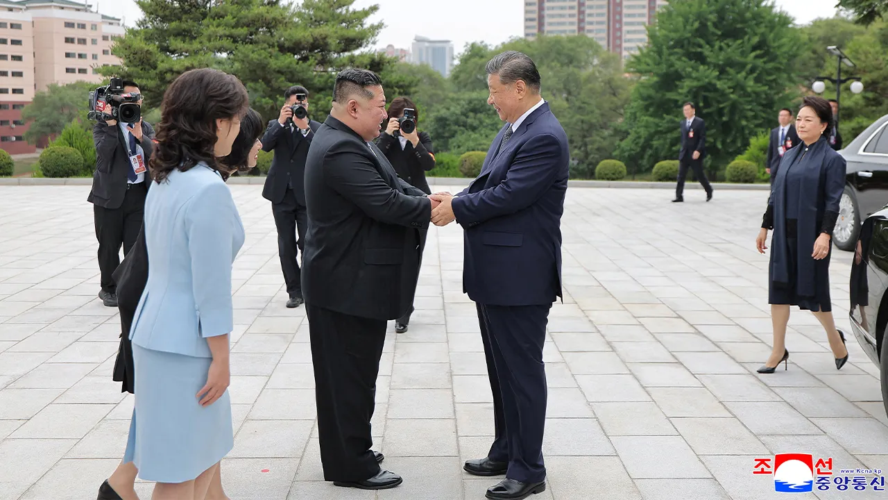 Chinese President Xi Jinping and North Korean leader Kim Jong Un greet as they visit the Tower of Friendship in Pyongyang, North Korea, June 9, 2026, in this picture released June 10, 2026. KCNA via REUTERS ATTENTION EDITORS - THIS IMAGE WAS PROVIDED BY A THIRD PARTY. REUTERS IS UNABLE TO INDEPENDENTLY VERIFY THIS IMAGE. NO THIRD PARTY SALES. SOUTH KOREA OUT. NO COMMERCIAL OR EDITORIAL SALES IN SOUTH KOREA.