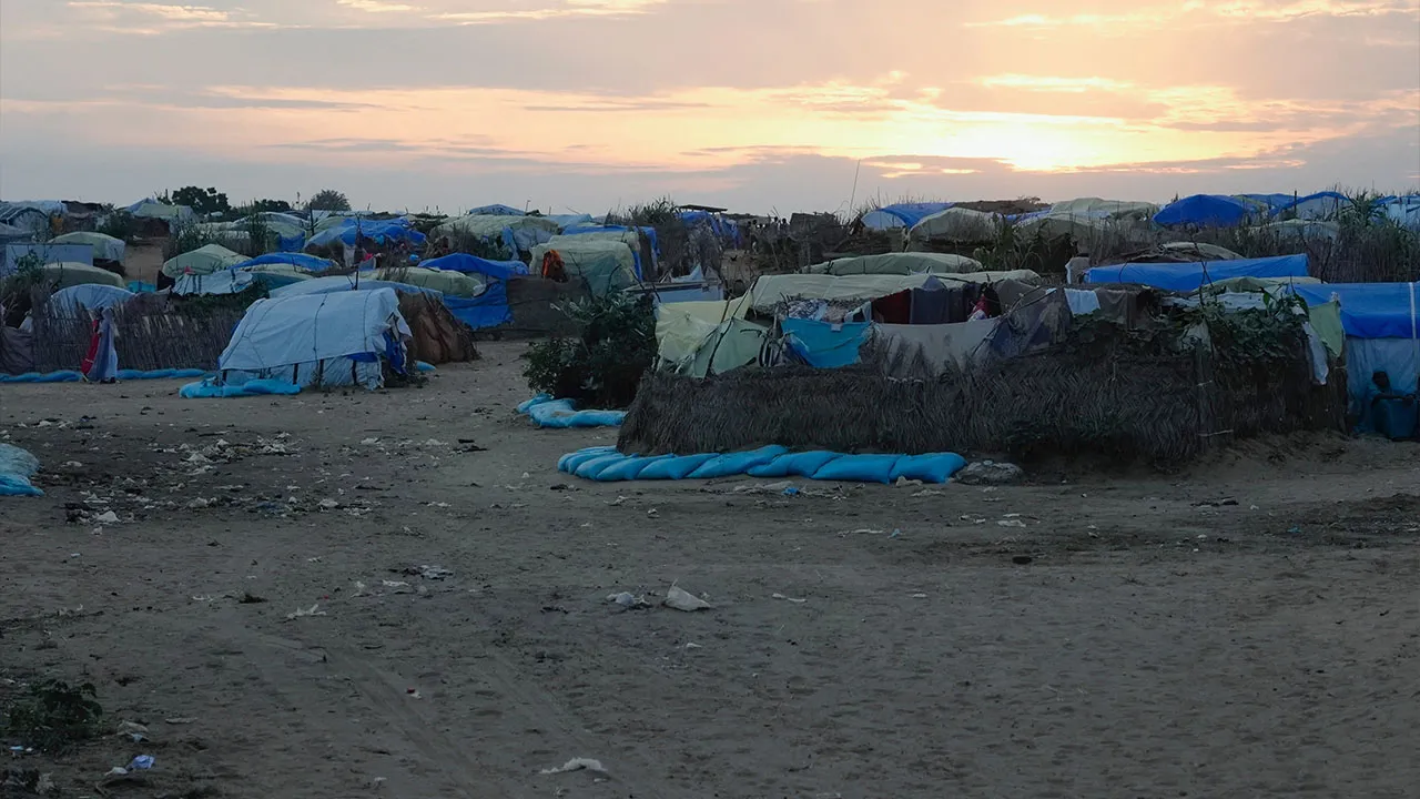 The sun sets on a refugee camp set up people fleeing war in Sudan, Oct. 3, 2024, in Adre, Chad. (AP Photo/Sam Mednick)