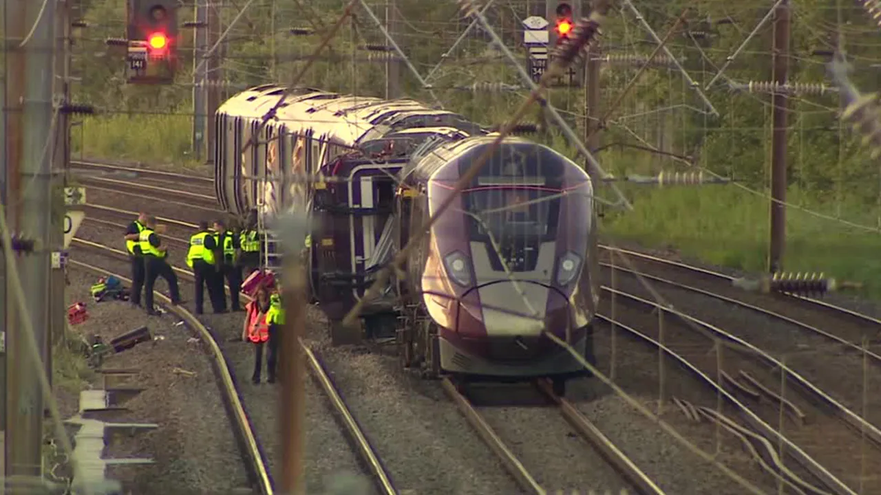 A train driver was killed and dozens more injured in a collision between two commuter services about 60 miles (100 km) north of London on Friday (June 19) afternoon.