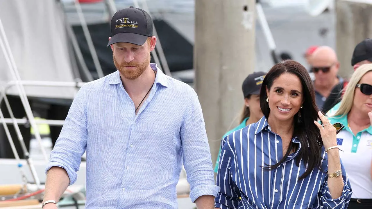 FILE PHOTO: Britain's Prince Harry and Meghan, the Duke and Duchess of Sussex, arrive at Rushcutters Bay following a sail on Sydney Harbour with veterans from the Invictus Australia community, in Sydney, Australia, April 17, 2026. REUTERS/Hollie Adams/File Photo