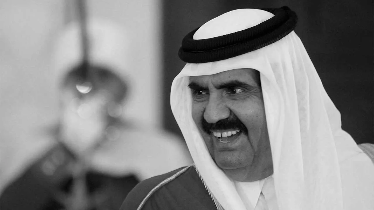 FILE PHOTO: Qatar's Emir Hamad bin Khalifa al-Thani smiles upon his arrival at Houari Boumediene Airport in Algiers January 7, 2013. REUTERS/Louafi Larbi/File Photo