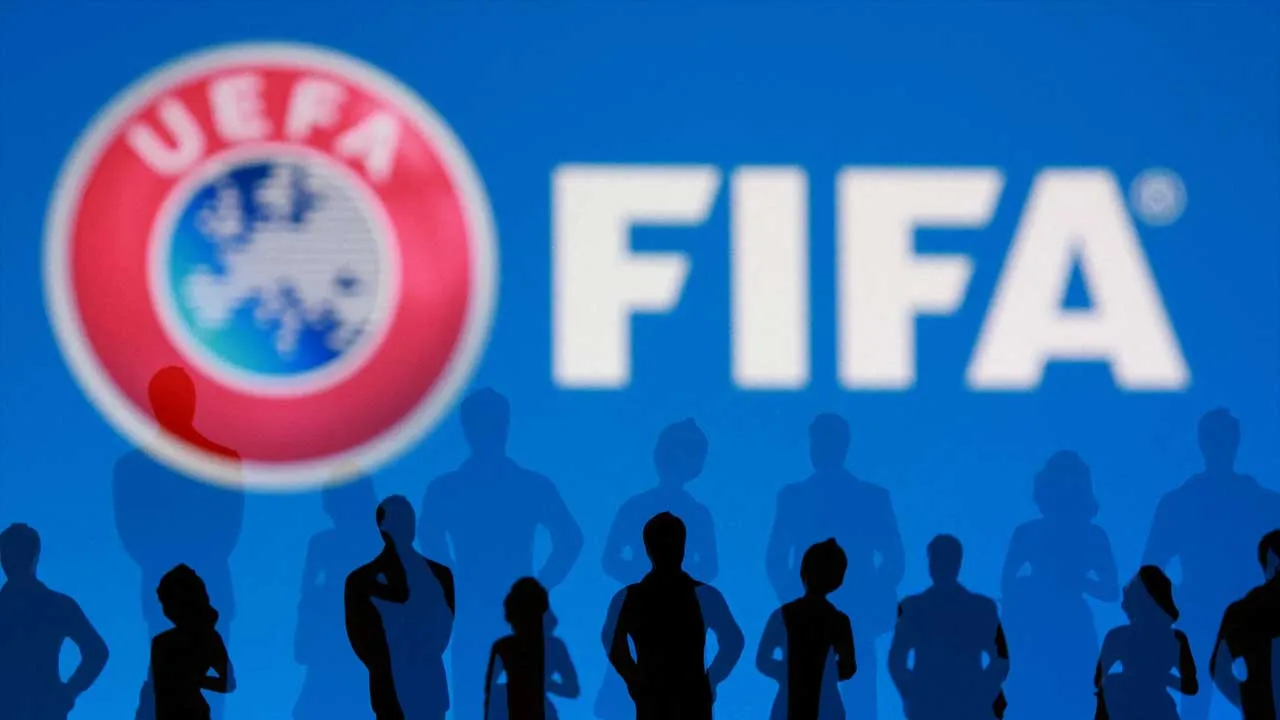 FIFA and UEFA logos and silhouettes of people are seen in this illustration taken July 30, 2026. REUTERS/Dado Ruvic/Illustration