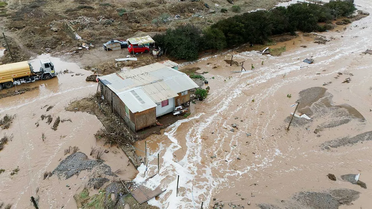 A drone view shows a house surrounded by flood waters after heavy rainfall from a weather front caused flooding and led the Chilean authorities to declare a state of emergency in La Serena, Chile, July 20, 2026. REUTERS/Jorge Vega