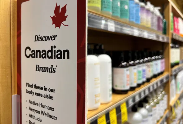 A sign invites customers to choose Canadian products in a personal hygiene aisle at a Whole Foods store in Vancouver, British Columbia, Canada July 20, 2026. Picture taken with a mobile phone. REUTERS/Chris Helgren