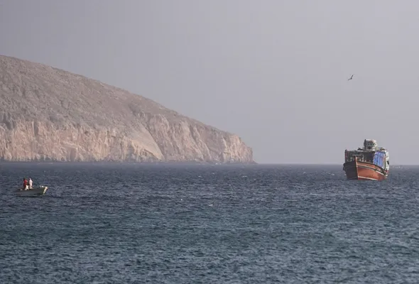 A vessel in the Strait of Hormuz, as seen from Musandam,Oman, July 16, 2026. REUTERS/Stringer