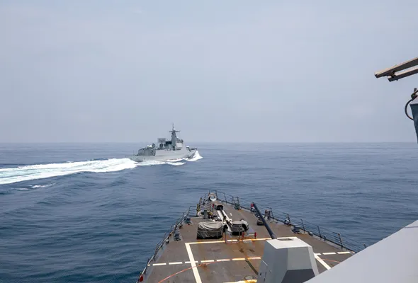 A Chinese Luyang III class warship sails near the U.S. destroyer USS Chung-Hoon, as seen from the deck of U.S. destroyer, in the Taiwan Strait, June 3, 2023, in this handout picture. U.S. Navy/Mass Communication Specialist 1st Class Andre T. Richard/Handout via REUTERS THIS IMAGE HAS BEEN SUPPLIED BY A THIRD PARTY. MANDATORY CREDIT/File Photo