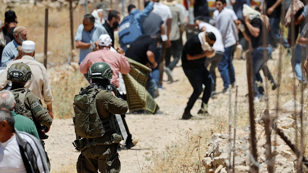 An Israeli soldier uses tear gas against Palestinians as they hold Friday prayers during a protest against Israeli settlement expansion and land confiscation near Bethlehem in the Israeli-occupied West Bank, July 3, 2026. REUTERS/Mussa Qawasma