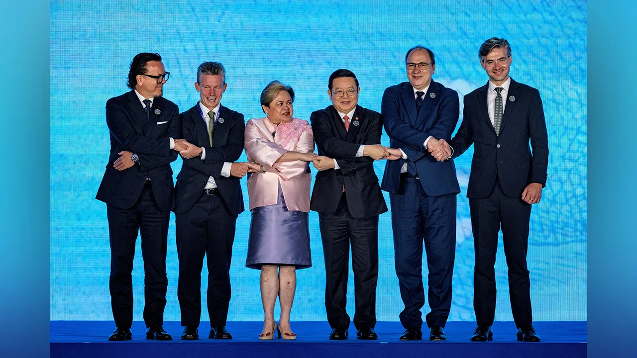 Poland Minister of State Assets Wojciech Balczun, Swedish Defense Minister Pal Jonson, Philippines Foreign Secretary Theresa Lazaro, ASEAN Secretary-General Kao Kim Hourn, Romania Minister of Education and Research Mihai Dimian, and Lithuania Foreign Minister Kestutis Budrys pose for photos during the signing ceremony for the Treaty of Amity and Cooperation in Southeast Asia (TAC), part of the ASEAN Foreign Ministers' Meeting, at the Philippine International Convention Center on July 24, 2026 in Pasay, Metr