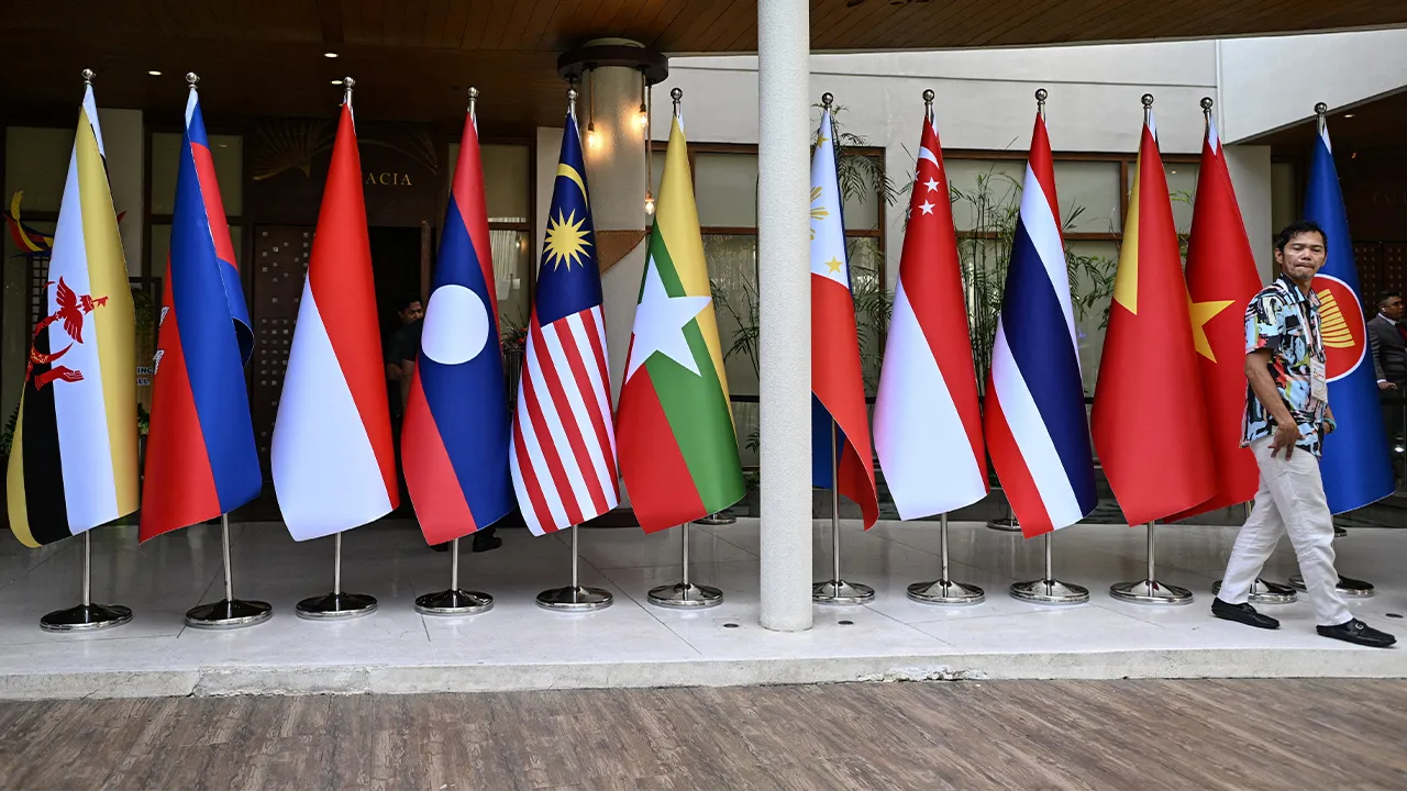 A man walks past flags of the Association of Southeast Asian Nations (ASEAN) at the International Media Center during the 59th ASEAN Foreign Ministers' Meeting and Related Meetings in Pasay, Metro Manila, Philippines, July 20, 2026. REUTERS/Noel Celis