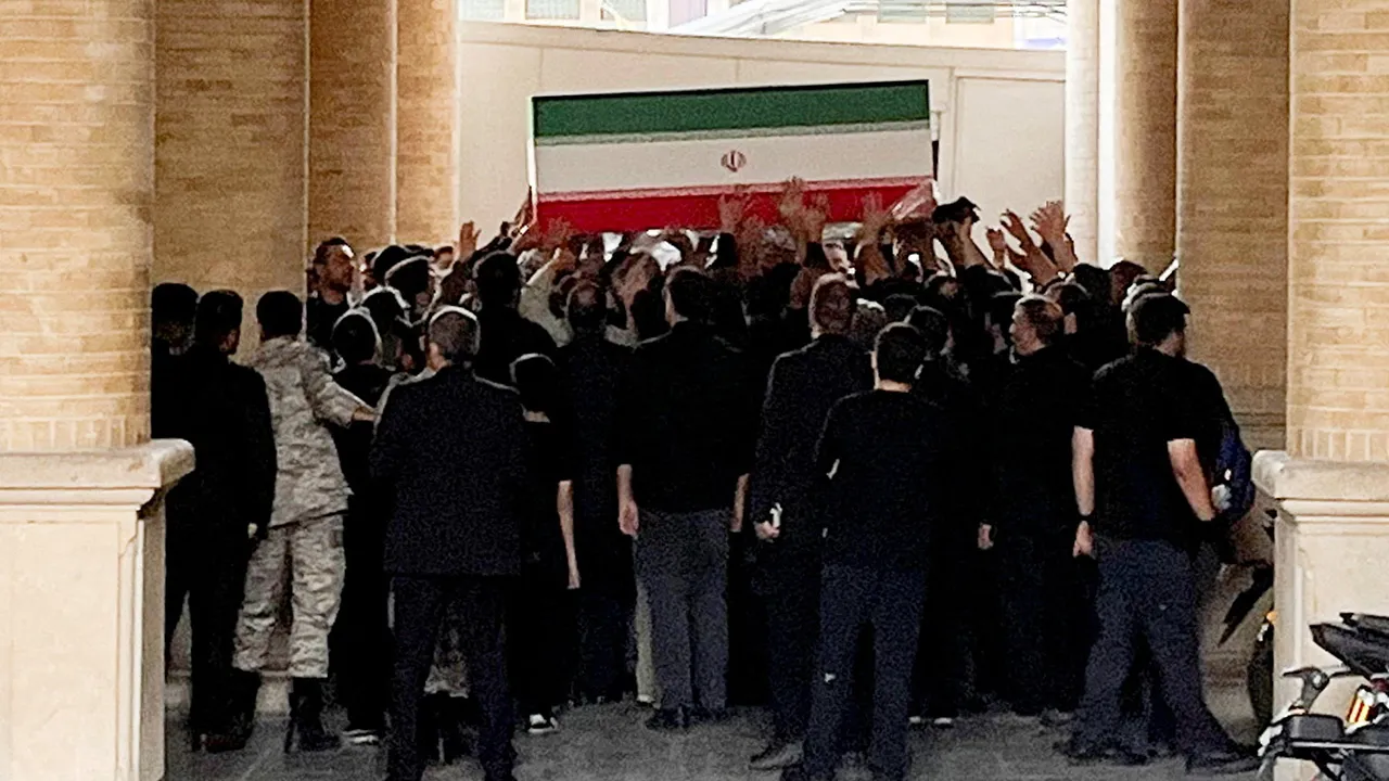 People carry a coffin as the bodies of Iran's late Supreme Leader Ayatollah Ali Khamenei and his family members are brought to the Imam Khomeini Grand Mosalla, on the day International delegates participate in a farewell ceremony for Khamenei, who was killed on February 28 during Israeli and U.S. airstrikes on Iran, in Tehran, Iran July 3, 2026. Picture taken using a mobile phone. Majid Asgaripour/WANA (West Asia News Agency) via REUTERS