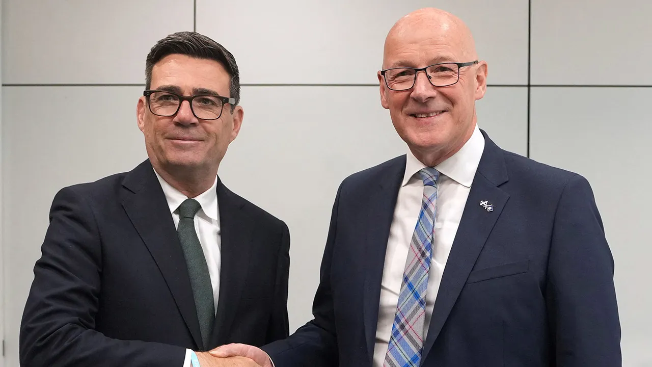 Britain's Prime Minister Andy Burnham shakes hands with Scotland's First Minister John Swinney as they meet for bilateral talks at the Atlantic Square in Glasgow, Scotland, Britain, July 23, 2026. Alastair Grant/Pool via REUTERS